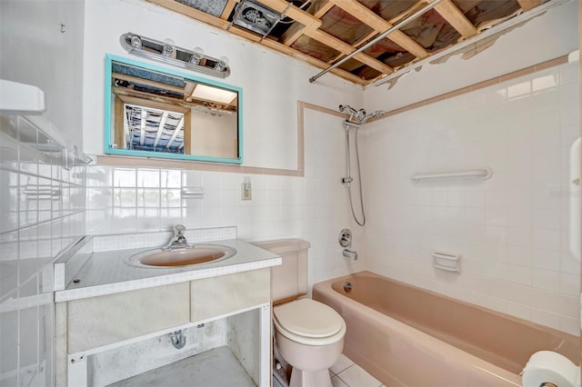 bathroom with toilet,  shower combination, tile walls, and vanity