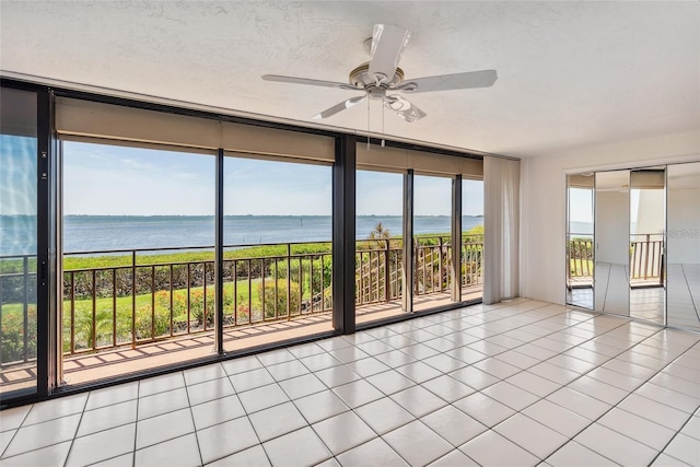 unfurnished sunroom with a water view