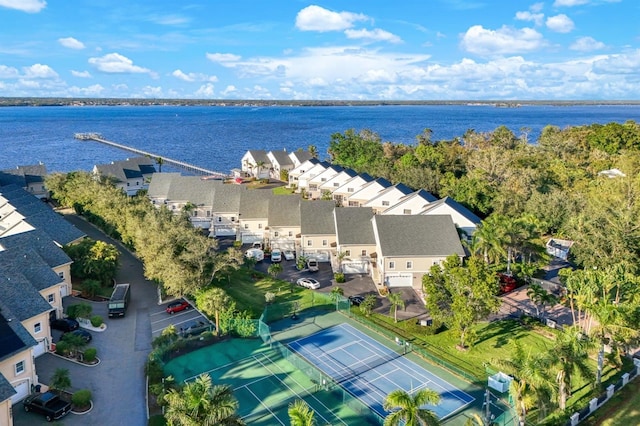 birds eye view of property with a water view and a residential view