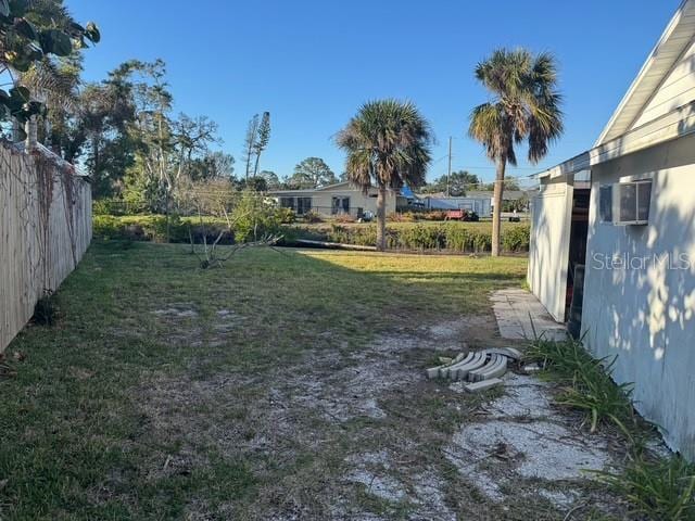 view of yard featuring fence