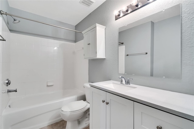 full bathroom featuring visible vents, a textured wall, toilet, tub / shower combination, and vanity