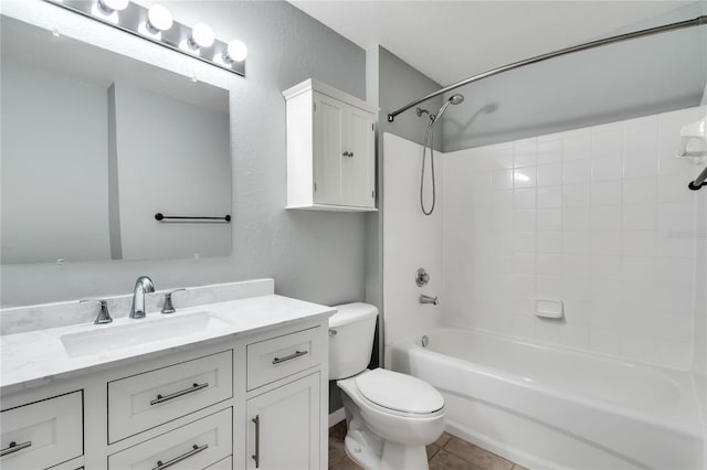 full bathroom with a textured wall, toilet, tile patterned flooring, tub / shower combination, and vanity