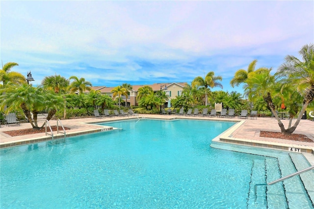 community pool featuring a patio area