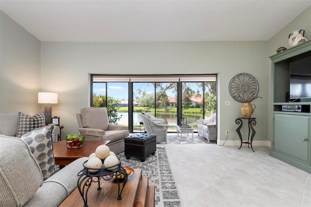 living area featuring baseboards