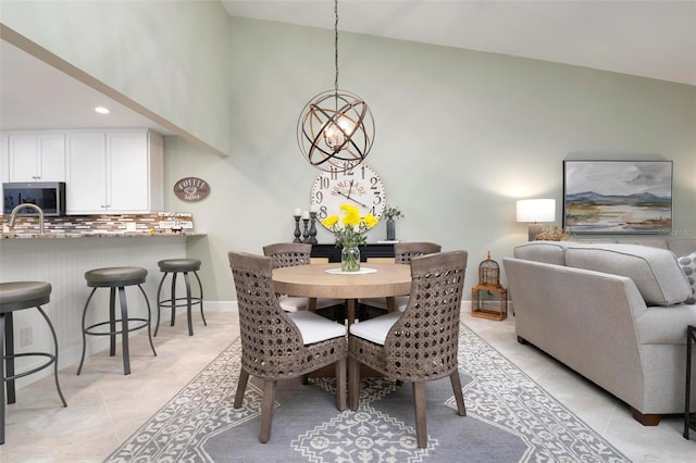 dining space featuring recessed lighting, baseboards, high vaulted ceiling, and light tile patterned flooring