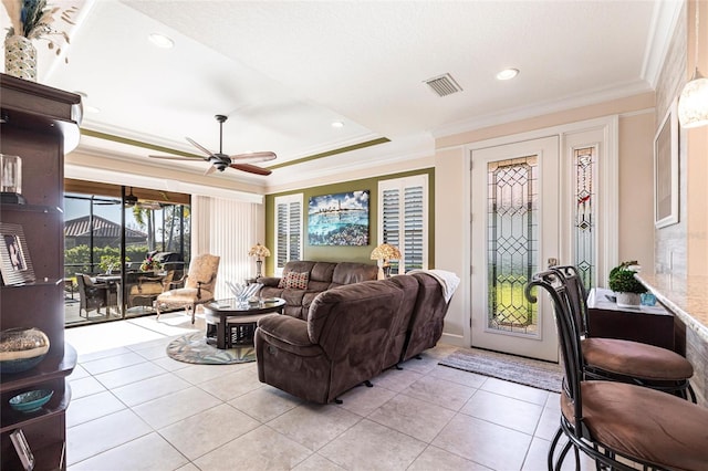 living area with visible vents, a ceiling fan, light tile patterned flooring, crown molding, and recessed lighting