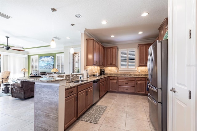 kitchen with light tile patterned floors, visible vents, decorative backsplash, appliances with stainless steel finishes, and a sink