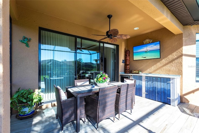 view of patio featuring ceiling fan