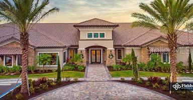 mediterranean / spanish home with a tile roof