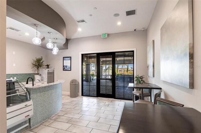 welcome area featuring french doors and visible vents