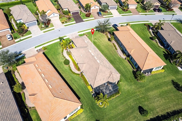 birds eye view of property with a residential view