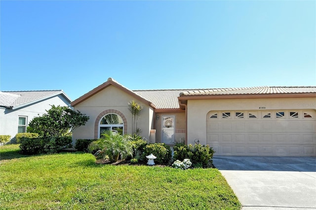 view of front of home with concrete driveway, a tiled roof, an attached garage, a front lawn, and stucco siding