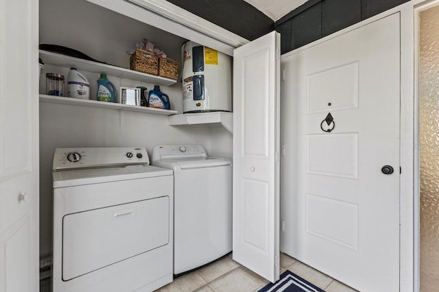 laundry room with light tile patterned floors, laundry area, and independent washer and dryer