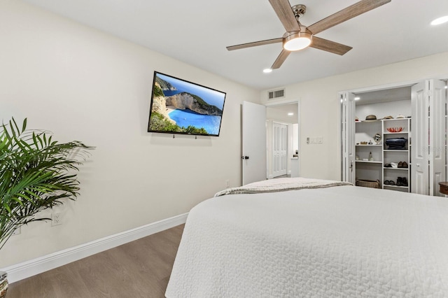 bedroom with recessed lighting, visible vents, ceiling fan, wood finished floors, and baseboards