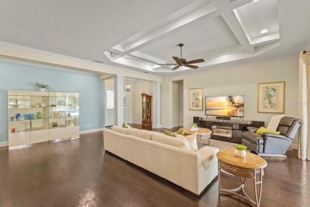 living area with coffered ceiling, wood-type flooring, and decorative columns