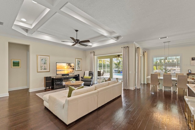 living room with a textured ceiling, dark wood-type flooring, coffered ceiling, and baseboards