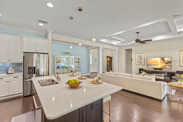 kitchen featuring dark wood-style flooring, coffered ceiling, a sink, open floor plan, and stainless steel refrigerator with ice dispenser