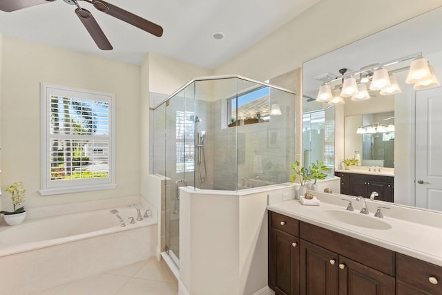 full bathroom featuring plenty of natural light, a shower stall, a garden tub, and tile patterned floors