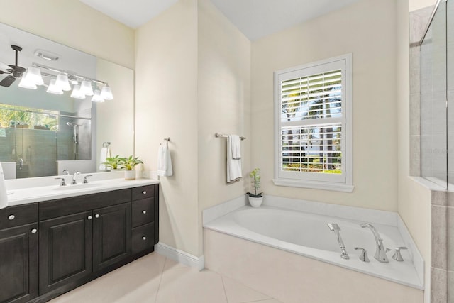 full bath with tile patterned flooring, vanity, a ceiling fan, a shower stall, and a bath