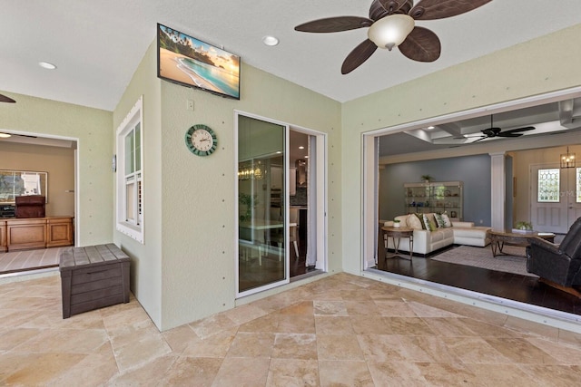 view of patio featuring a ceiling fan