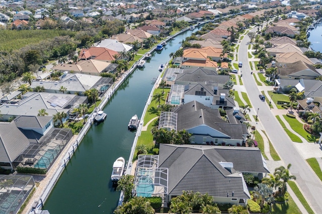 bird's eye view featuring a water view and a residential view