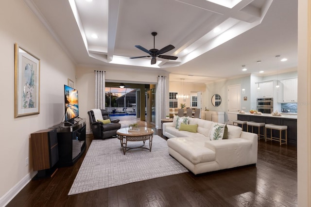 living room featuring baseboards, dark wood finished floors, a raised ceiling, ceiling fan, and recessed lighting