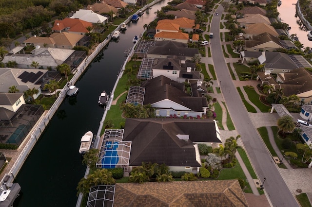 aerial view featuring a water view and a residential view