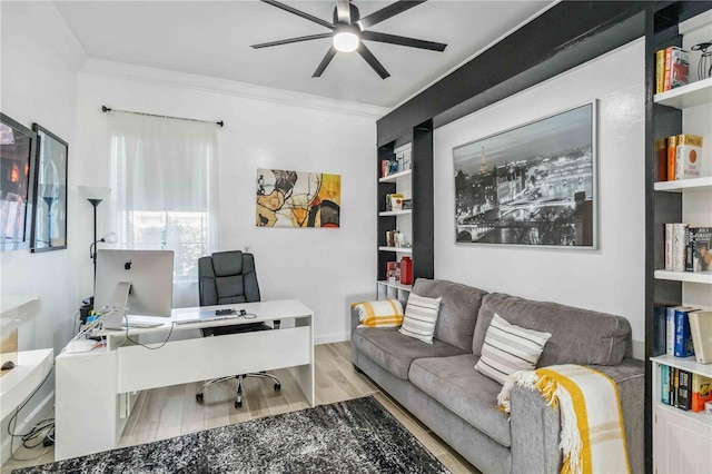 office area with ceiling fan, ornamental molding, and wood finished floors