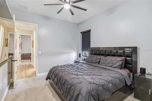 bedroom with a ceiling fan, carpet flooring, visible vents, and baseboards