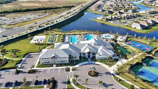 bird's eye view with a residential view and a water view