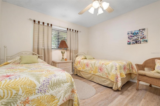 bedroom featuring ceiling fan and light wood-type flooring