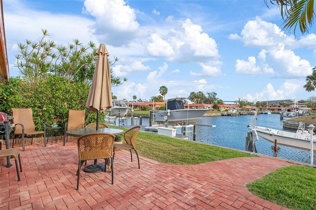 view of patio / terrace with a boat dock, a water view, and boat lift