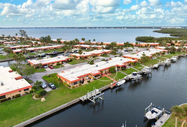 birds eye view of property featuring a water view