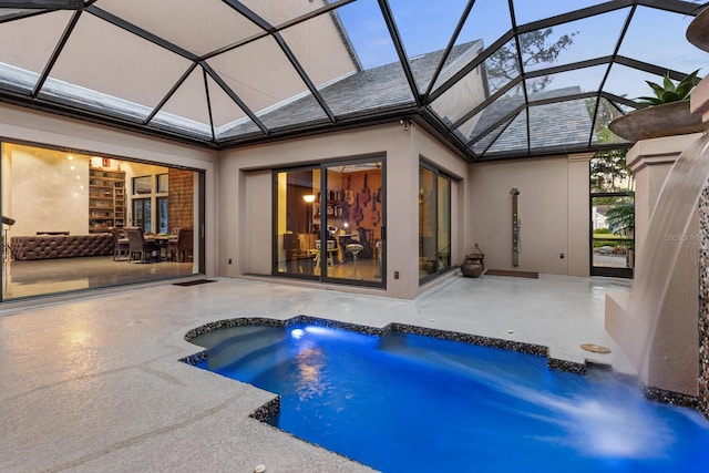 pool featuring a lanai and a patio area