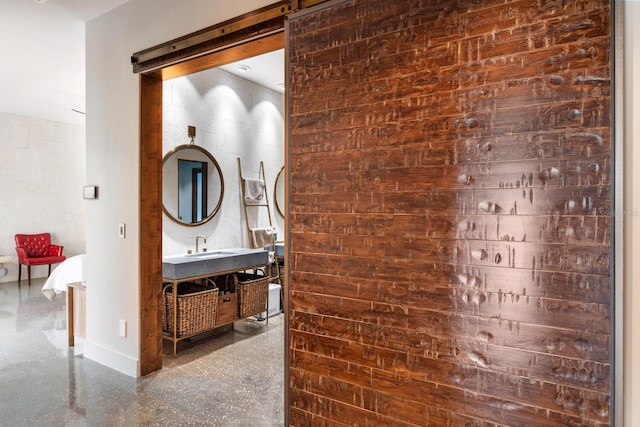 bathroom featuring vanity and baseboards