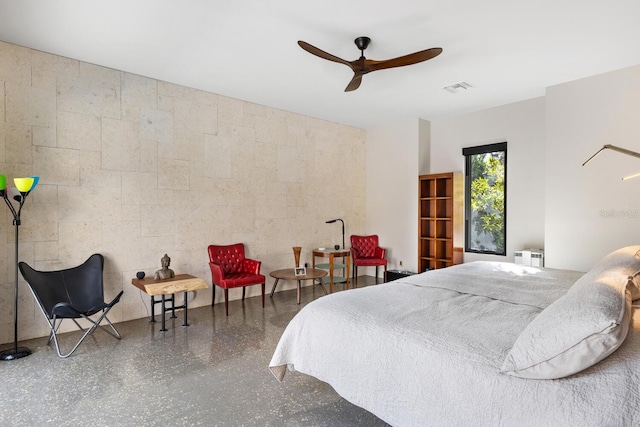 bedroom with radiator, visible vents, and speckled floor