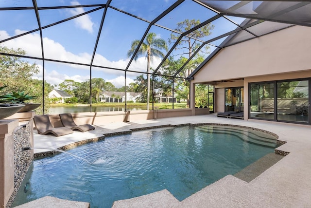 pool with glass enclosure, a patio, and a water view