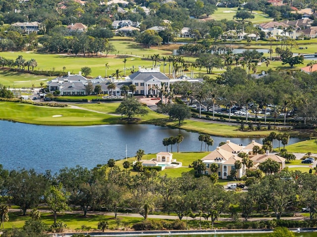 aerial view with a residential view, view of golf course, and a water view