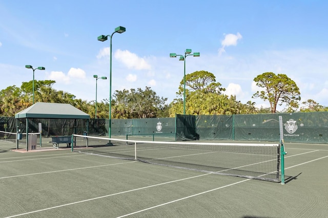 view of sport court with fence