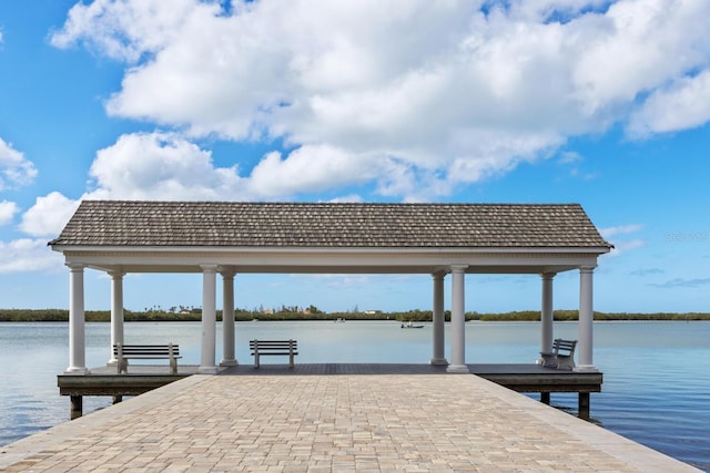 view of dock featuring a water view and a gazebo