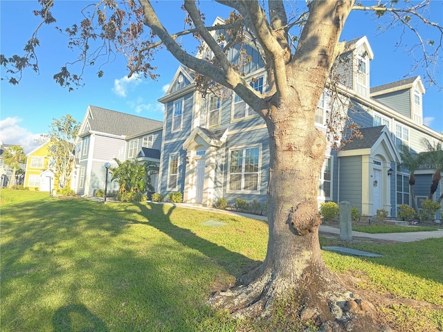 view of front of property with a front lawn and a residential view