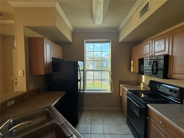 kitchen with visible vents, ornamental molding, light tile patterned flooring, a sink, and black appliances