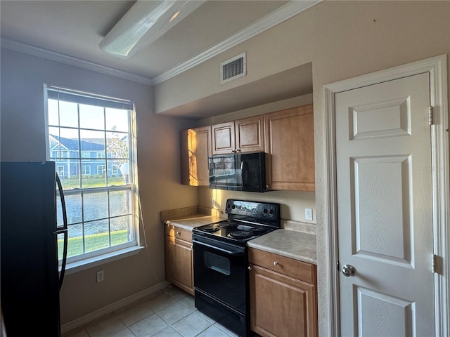 kitchen with visible vents, light countertops, ornamental molding, a wealth of natural light, and black appliances