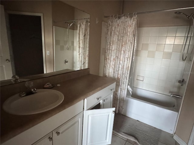 bathroom with tile patterned floors, shower / bath combo, and vanity