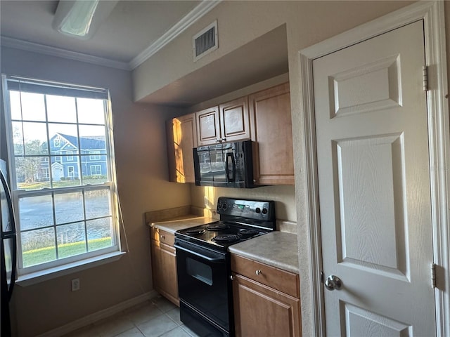 kitchen with baseboards, visible vents, light countertops, crown molding, and black appliances