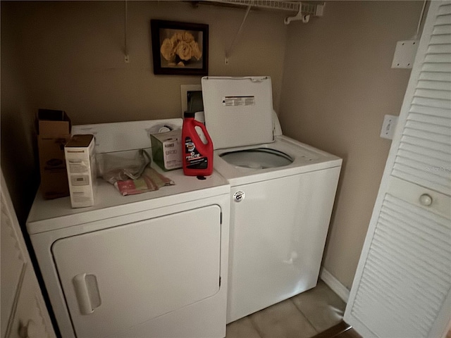 washroom featuring laundry area and washer and clothes dryer