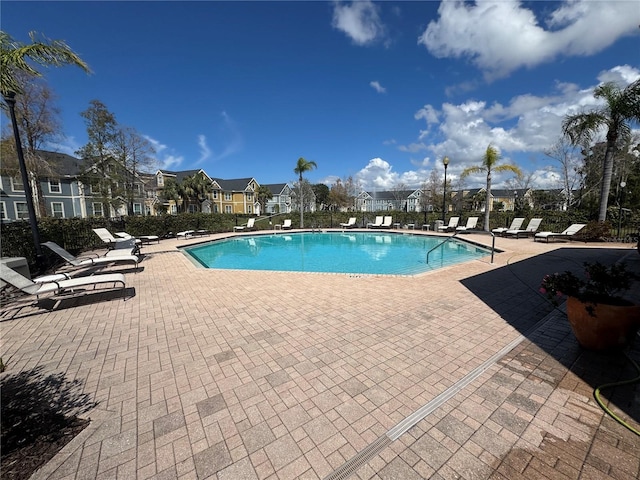 pool featuring a patio area and fence