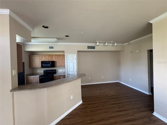 kitchen with ornamental molding, visible vents, and black appliances