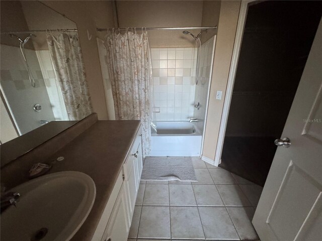 bathroom with shower / bath combo, vanity, and tile patterned floors