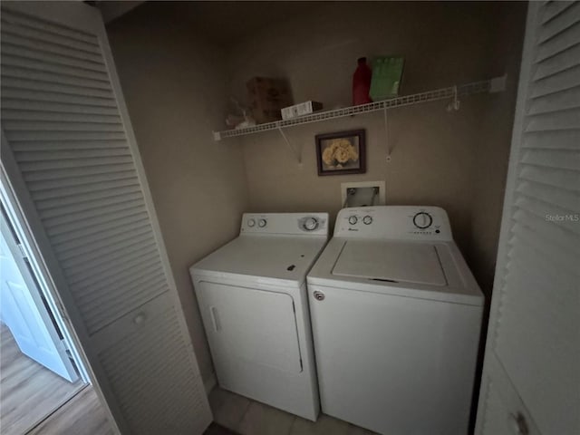 clothes washing area with laundry area and independent washer and dryer